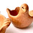 Mexico 1492: Graceful salsa bowl shaped as a bird with wings, made from red clay with a yellowish tone and marked with random flame spots, adding character. Best for serving salsa, appetizers, or salt and spices. Lead free, unglazed. Thanks to the artisanal nature of this handmade product, no two pieces are the same. 