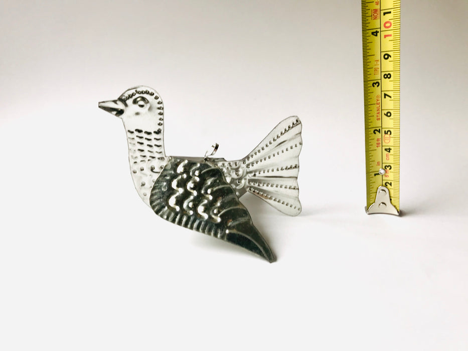 Mexico 1492 - Whimsical little bird that spreads its wings and adorns every Christmas tree, table, napkin or a fruit bowl you wish. Handmade by Oaxacan artisans, using the repujado (embossing) technique. 