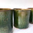 Mexico 1492: Small, green glazed clay cups, an ideal vessel for mixologists - they showcase lime and orange wedges or zest, olives, strawberries or salt like no other.   With the new, lead-free technique for glazing, we can safely enjoy these beauties today as utilitarian pieces in your kitchen or bar.