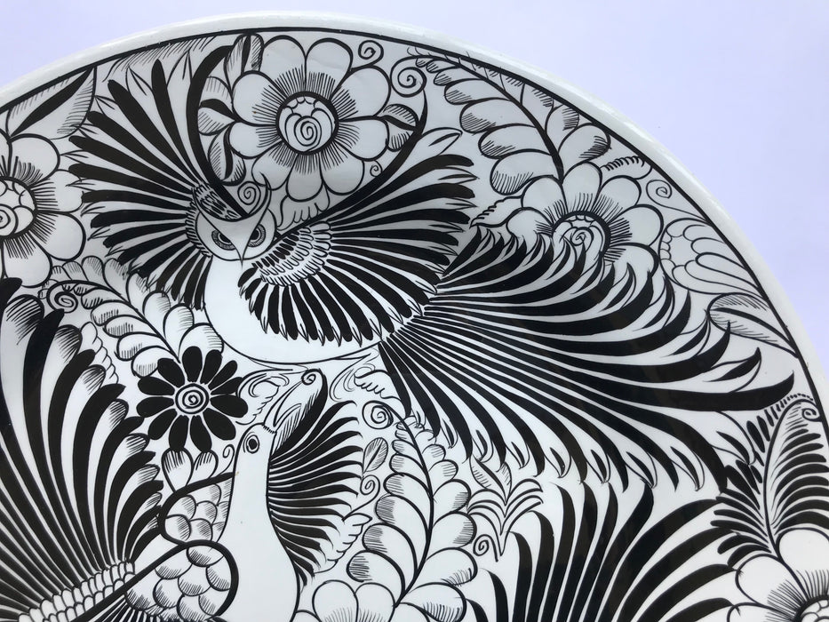 Mexico 1492: The talented young artisan Isabel from Guerrero created this amazing, large, black and white serving plate, hand painted with motifs of birds and greenery, and glazed. An eye-catcher, and a piece that beings the traditional folk art to the modern era in a seamless way.