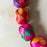 Mexico 1492: Traditional colorful Mexican Christmas decoration, a garland hand made of palm leaves in Guerrero. It can adorn a Christmas tree, or be piled up on a plate or in a fruit bowl to add a pop of color on a shelf or a table. 3.4m (11ft) long. 
