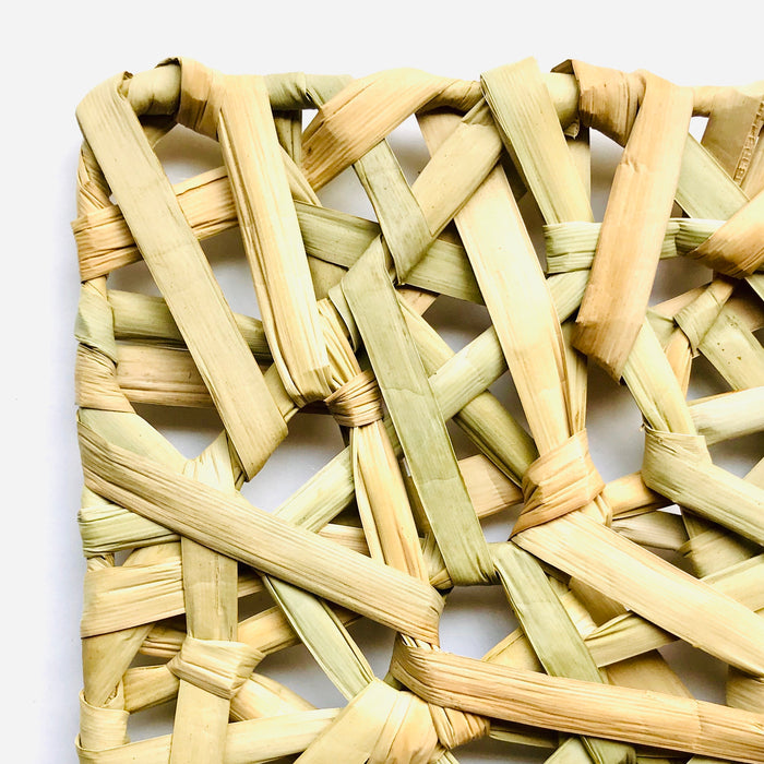 Mexico 1492 - Bulrush fiber, woven as a web on a square metalic frame. A placemat that is beautiful to look at and feels soothing under the fingertips. 