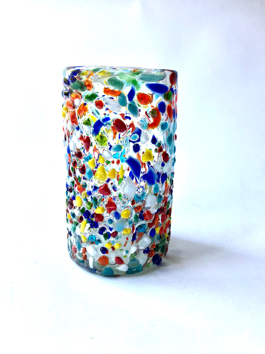 Mexico 1492 - Cylindric, hand blown glasses, handmade in Mexico, the essential ingredient of every gathering. Confetti glass made with hundreds of tiny, melted pieces of colored glass, feels bumpy but smooth. 