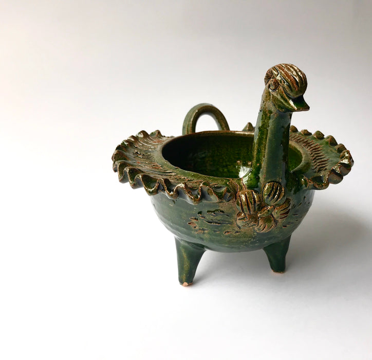 Mexico 1492: Whimsical bird-shaped salsa bowls, with ornaments like flowers or fruit. Made of clay, then bathed in spectacular, world-famous, lead-free green glaze.  With the new, lead-free technique for glazing, we can safely enjoy these beauties today as both decorative and utilitarian pieces. Great for serving salsa, appetizers, dips, marmalade, salt and spices.