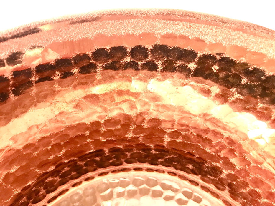 Mexico 1492: A hammered copper saucepan (or better known as cazo in Mexico), handmade in Santa Clara del Cobre, by one of the oldest, most respected coppersmith workshops of don Viduel. The copper hammering process is lengthy and arduous, but the shaping is done through a series of soft hammer blows that create the recognizable indentations on the surface. 