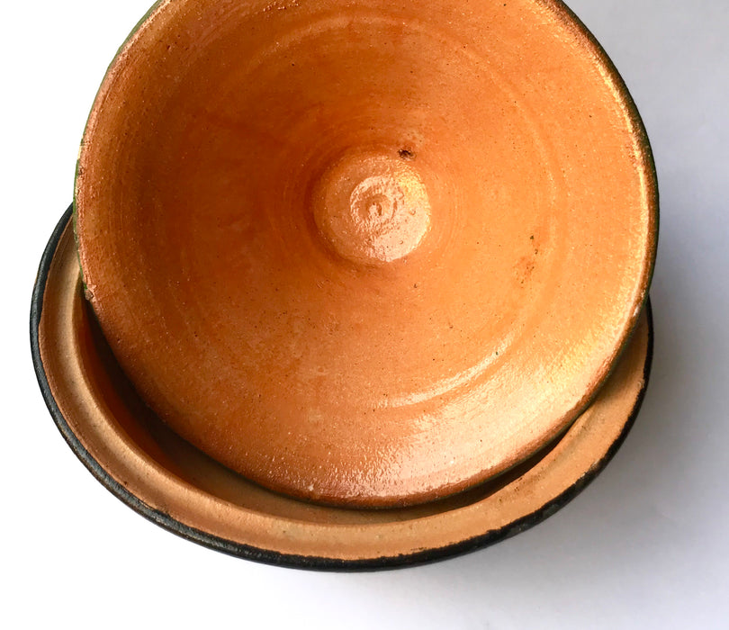 Mexico 1492: What happens when a traditional Morroccan clay dish gets transformed by warm, colorful, unstoppable Mexican creativity? Don Abel y doña Matea created a cultural fusion of Mexico and North Africa, so beautiful and imaginative. Traditional tajine, the predecessor of the modern crock pot, embellished by the talent and skill of the amazing Oaxacan artisans.  Handmade, painted and lead-free glazed in Oaxaca, Mexico.  Version: Green Maguey.