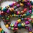 Mexico 1492: Traditional colorful Mexican Christmas decoration, a garland hand made of palm leaves in Guerrero. It can adorn a Christmas tree, or be piled up on a plate or in a fruit bowl to add a pop of color on a shelf or a table. 3.4m (11ft) long. 