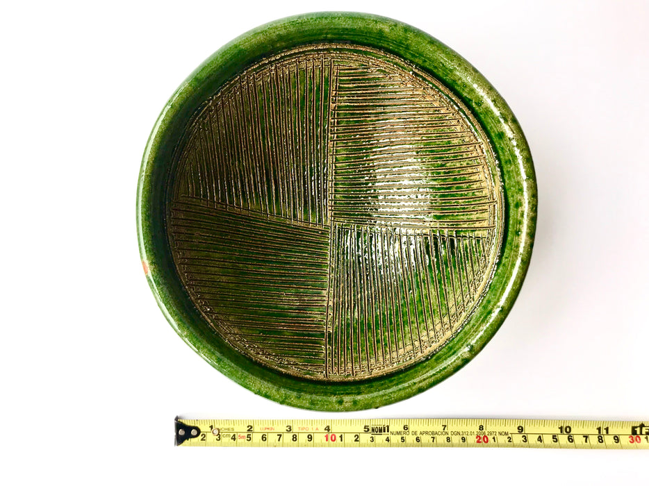 Mexico 1492:  A different mortar: its surface is covered with fine, parallel crease pattern that grinds the food as we pull it while pressing down firmly. Ideal for making green and red salsas, as well as serving guacamole or other appetizers.  With the new, lead-free technique for glazing, we can safely enjoy these beauties today as both decorative and utilitarian pieces. 