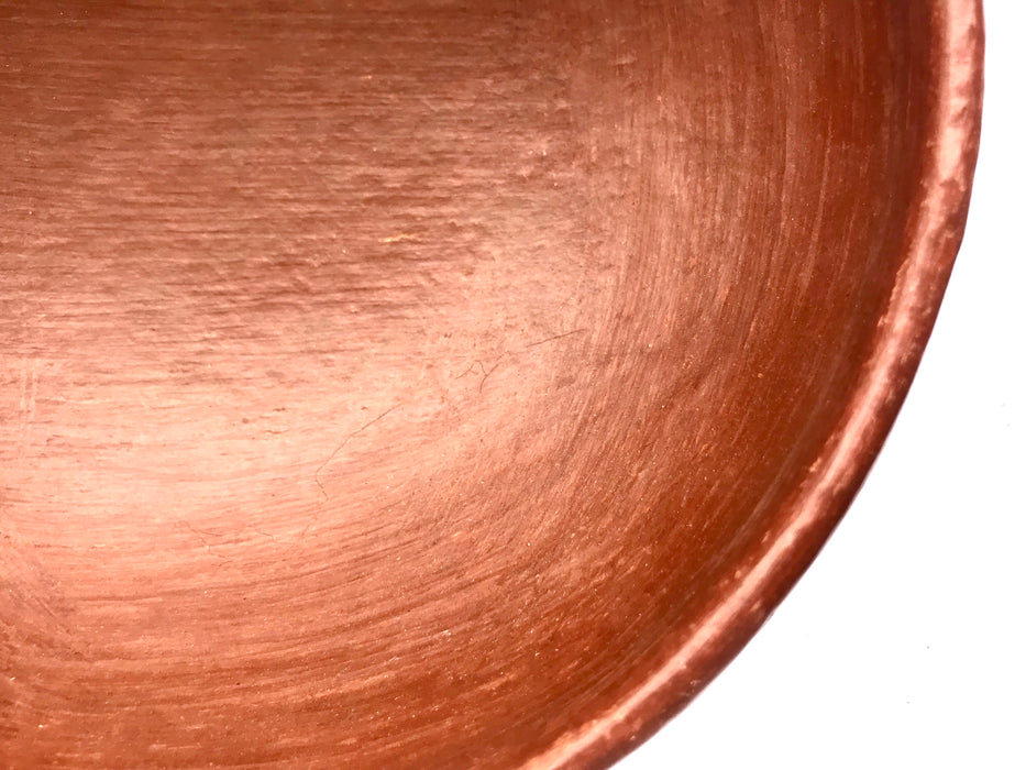 Mexico 1492: Salad bowl, made out of beautiful, red clay, and polished until a special glow is achieved. The rough beauty of the San Marcos pottery transcends its humble origins. It is usually women that work with the clay, and these bowls are no exception.   Lead free, unglazed. Thanks to the amazing, random pattern of the flame marks, no two pieces are the same. 