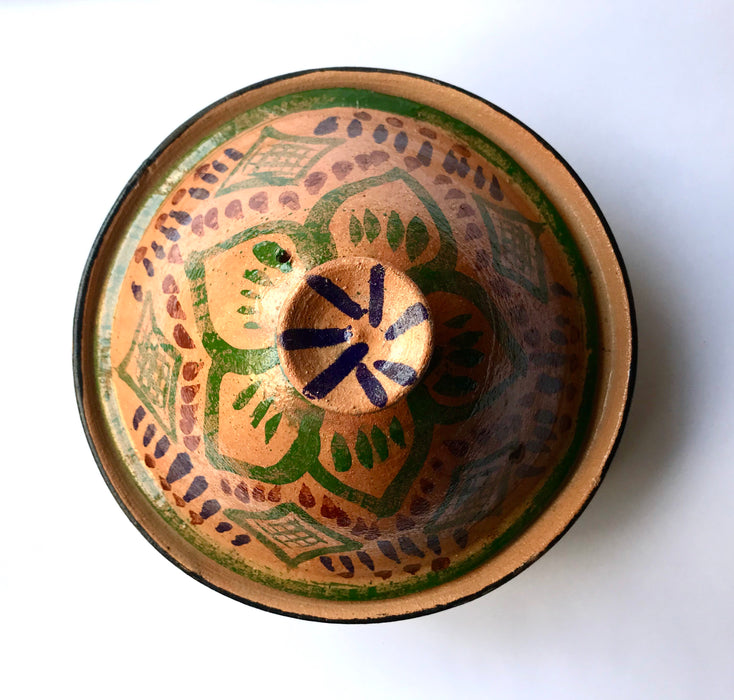 Mexico 1492: What happens when a traditional Morroccan clay dish gets transformed by warm, colorful, unstoppable Mexican creativity? Don Abel y doña Matea created a cultural fusion of Mexico and North Africa, so beautiful and imaginative. Traditional tajine, the predecessor of the modern crock pot, embellished by the talent and skill of the amazing Oaxacan artisans.  Handmade, painted and lead-free glazed in Oaxaca, Mexico.  Version: Green Maguey.