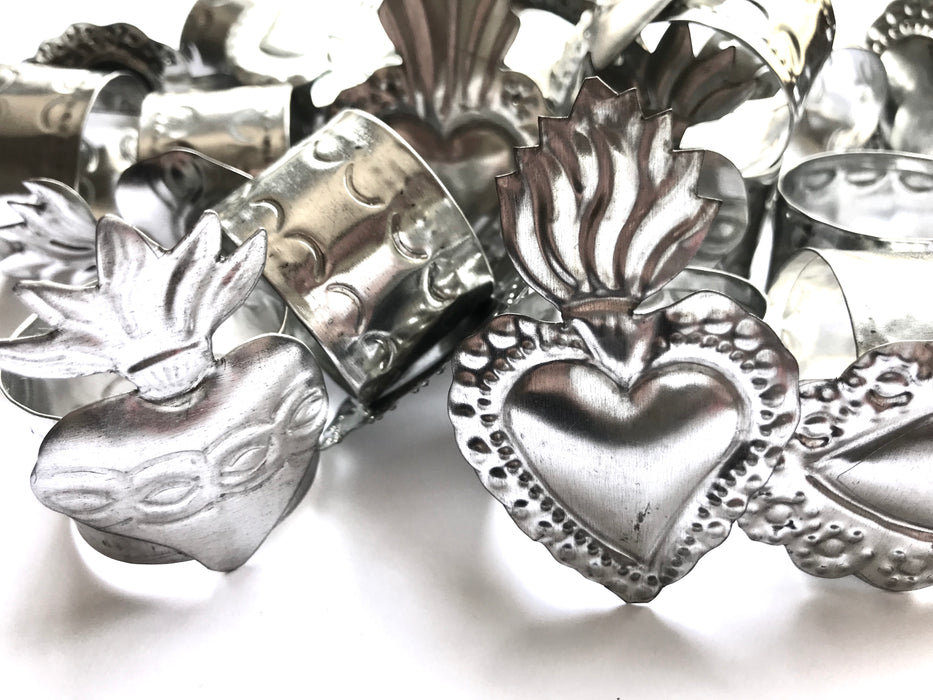 Mexico 1492: Handmade by Oaxacan artisans, using the repujado (embossing) technique, the Sacred Heart napkin holders celebrate one of the most frequently found motifs in the Mexican folk art. Available in 3 charming versions: Thorns, Beams and Flames.
