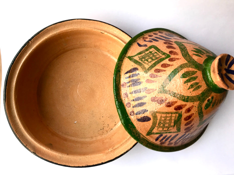 Mexico 1492: What happens when a traditional Morroccan clay dish gets transformed by warm, colorful, unstoppable Mexican creativity? Don Abel y doña Matea created a cultural fusion of Mexico and North Africa, so beautiful and imaginative. Traditional tajine, the predecessor of the modern crock pot, embellished by the talent and skill of the amazing Oaxacan artisans.  Handmade, painted and lead-free glazed in Oaxaca, Mexico.  Version: Green Maguey.