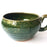 Mexico 1492: A wide, green glazed clay cup, with beautiful texture on the outside, and a symbolic swirl on the inside. Ideal for the morning cup of rich, foamy Oaxacan coffee, and a piece of sweet bread served with it.   Lead-free, handmade and glazed by the amazing artisans in Oaxaca, Mexico. 