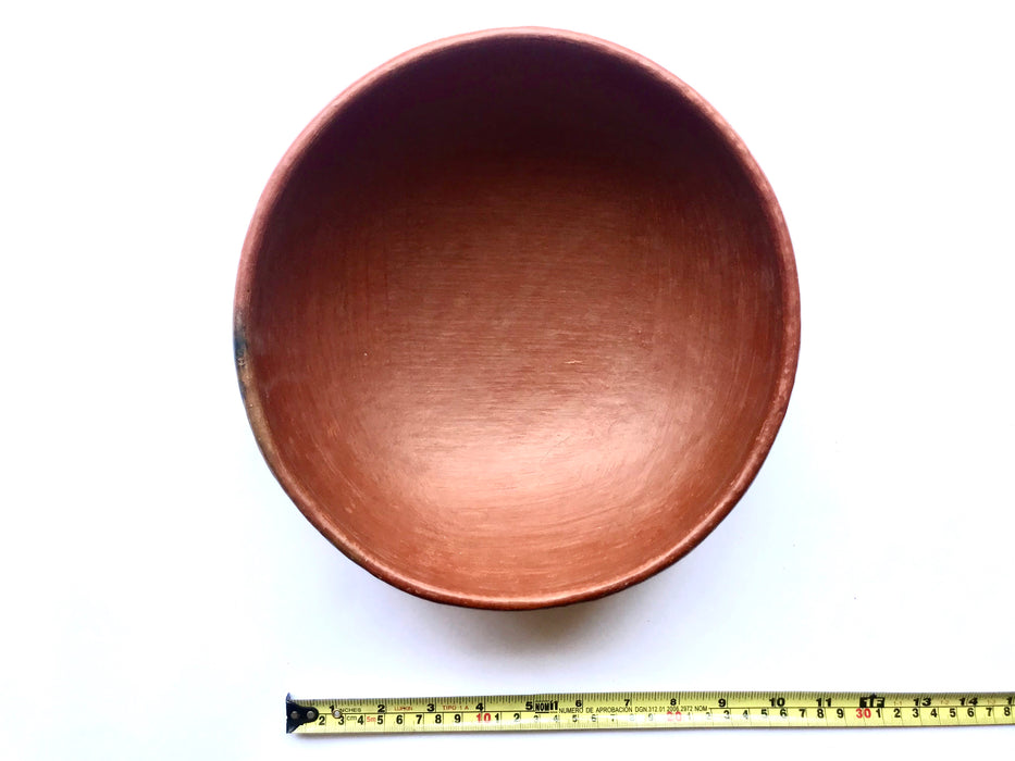 Mexico 1492: Salad bowl, made out of beautiful, red clay, and polished until a special glow is achieved. The rough beauty of the San Marcos pottery transcends its humble origins. It is usually women that work with the clay, and these bowls are no exception.   Lead free, unglazed. Thanks to the amazing, random pattern of the flame marks, no two pieces are the same. 