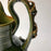 Green Glazed Clay Pitcher with Flower Ornaments