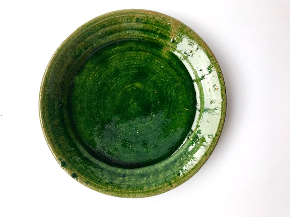 Mexico 1492: A wide, green glazed clay cup, with beautiful texture on the outside, and a symbolic swirl on the inside. Ideal for the morning cup of rich, foamy Oaxacan coffee, and a piece of sweet bread served with it.   Lead-free, handmade and glazed by the amazing artisans in Oaxaca, Mexico. 