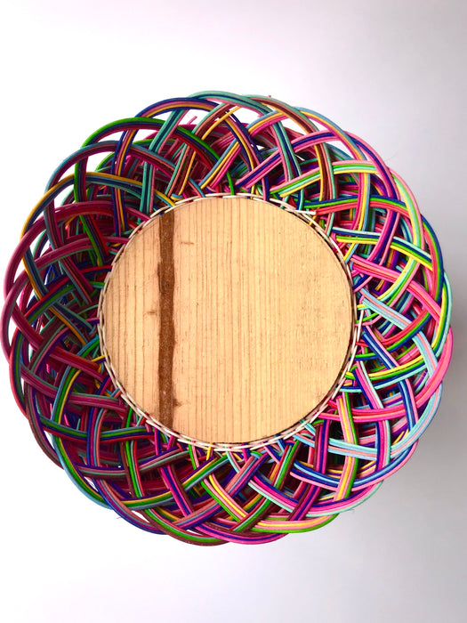Mexico 1492: Thin wicker strings in many colors flow together and create this cheerful bread basket with a wooden base. Hand made by artisans from Estado de Mexico. 