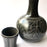 Mexico 1492: The black “cántaro” (pitcher), hand made out of clay, hand painted with birds, flowers and leaves, and burnished to shine. Accompanied by a matching glass. Used for storing liquids, like water or wine.   “Cántaro” is a precious piece in every Mexican home, and a favorite way to store water. It is believed that water stays cool in a “cántaro” even on a hottest day.
