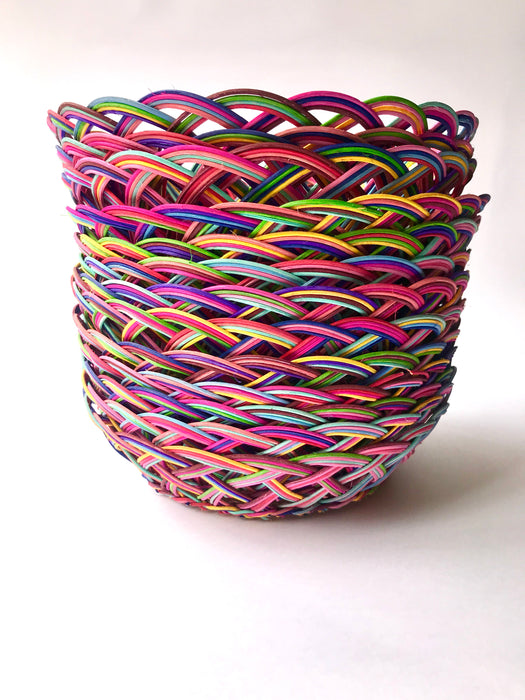 Mexico 1492: Thin wicker strings in many colors flow together and create this cheerful bread basket with a wooden base. Hand made by artisans from Estado de Mexico. 