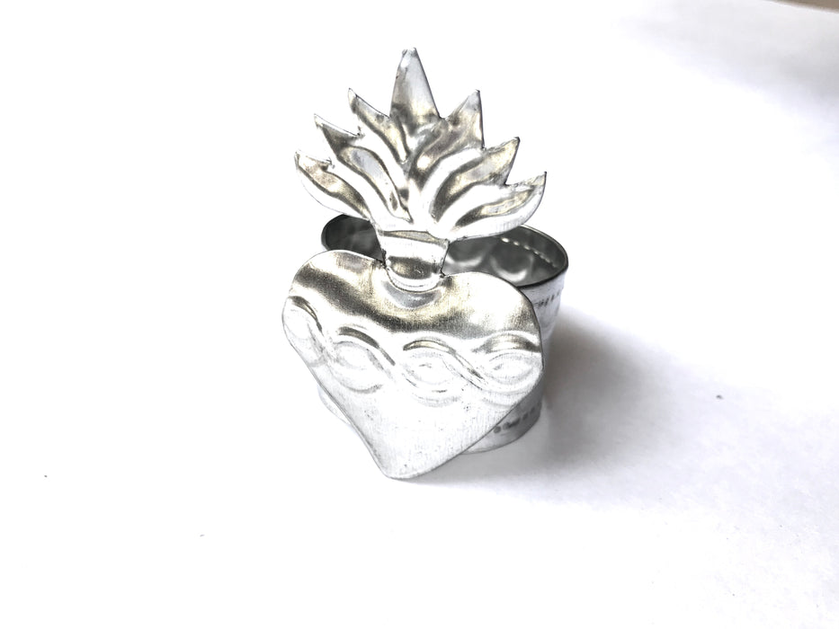 Mexico 1492: Handmade by Oaxacan artisans, using the repujado (embossing) technique, the Sacred Heart napkin holders celebrate one of the most frequently found motifs in the Mexican folk art. Available in 3 charming versions: Thorns, Beams and Flames.