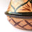 Mexico 1492: What happens when a traditional Morroccan clay dish gets transformed by warm, colorful, unstoppable Mexican creativity? Don Abel y doña Matea created a cultural fusion of Mexico and North Africa, so beautiful and imaginative. Traditional tajine, the predecessor of the modern crock pot, embellished by the talent and skill of the amazing Oaxacan artisans. Handmade, painted and lead-free glazed in Oaxaca, Mexico. Version: Black Agave.