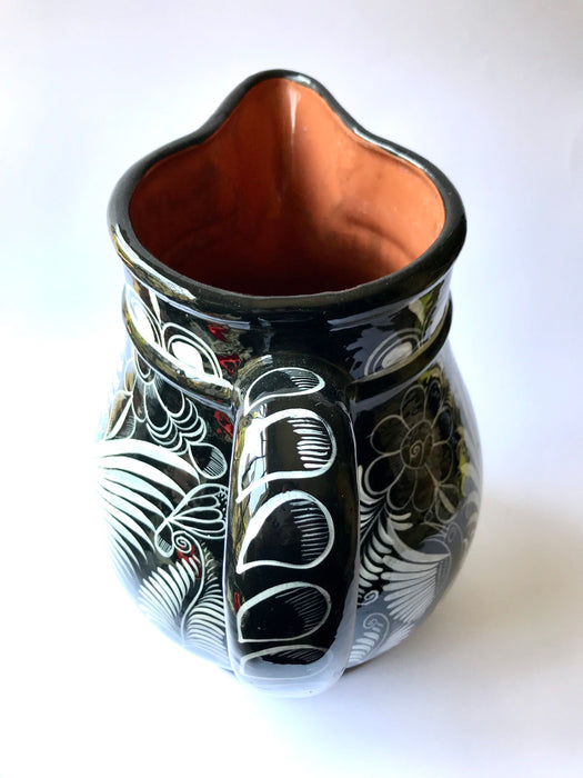Mexico 1492 - Large, glazed, hand painted pitcher. Black with white drawings of plants and birds. Artisanal work from Guerrero, Mexico. 