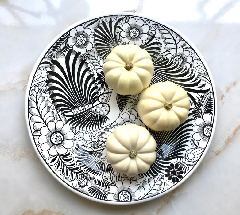 Mexico 1492: The talented young artisan Isabel from Guerrero created this amazing, large, black and white serving plate, hand painted with motifs of birds and greenery, and glazed. An eye-catcher, and a piece that beings the traditional folk art to the modern era in a seamless way.