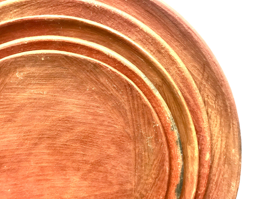 Mexico 1492: An impressive lunch or dessert plate, made from groovy, red clay and marked with random flame spots, adding character. Still showing the line marks of the artisan's work with the quartz stone. Lead free, unglazed. Thanks to the amazing, random pattern of the quartz polish lines and the flame marks, no two pieces are the same. 