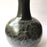 Mexico 1492: The black “cántaro” (pitcher), hand made out of clay, hand painted with birds, flowers and leaves, and burnished to shine. Accompanied by a matching glass. Used for storing liquids, like water or wine.   “Cántaro” is a precious piece in every Mexican home, and a favorite way to store water. It is believed that water stays cool in a “cántaro” even on a hottest day.