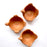 Mexico 1492: Graceful salsa bowl shaped as a bird with wings, made from red clay with a yellowish tone and marked with random flame spots, adding character. Best for serving salsa, appetizers, or salt and spices. Lead free, unglazed. Thanks to the artisanal nature of this handmade product, no two pieces are the same. 