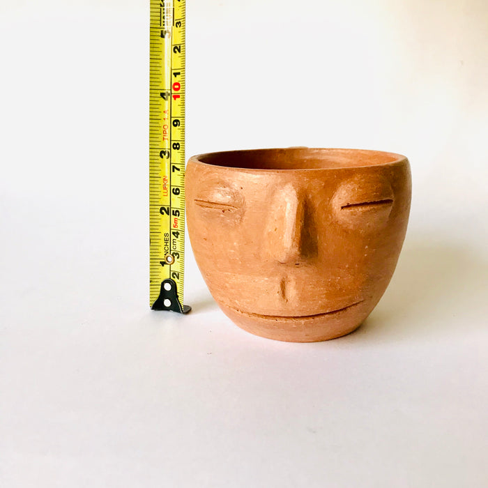 Red Clay Cup with a Face