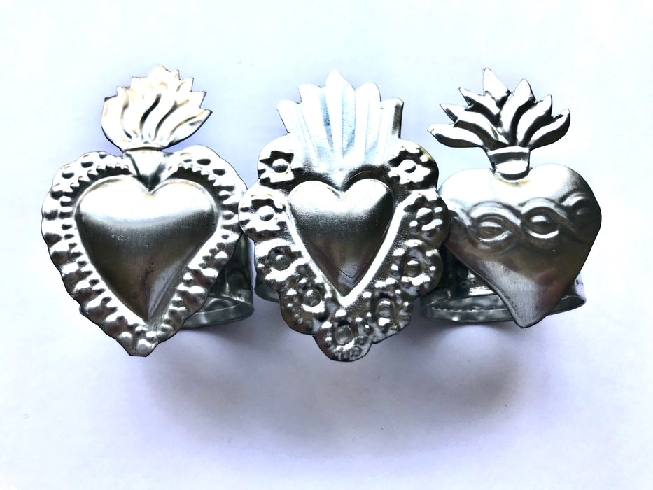 Mexico 1492: Handmade by Oaxacan artisans, using the repujado (embossing) technique, the Sacred Heart napkin holders celebrate one of the most frequently found motifs in the Mexican folk art. Available in 3 charming versions: Thorns, Beams and Flames.