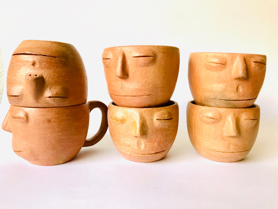Red Clay Cup with a Face