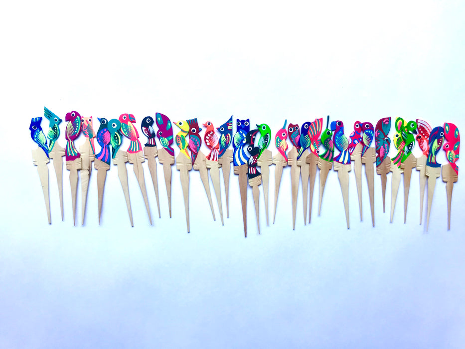 Mexico 1492: Painted Wooden Bird Shaped Picks. Ideal for serving cheese cubes, olives, or appetizers of any kind, but also the lemon slices with tequila, or the orange slices with a smooth, smoky mezcal shot. Colorful, hand-painted, with the bird pattern, this Oaxacan basic utensil, so simple in function but so rich in visual effect, enlightens your reunions like no other pick can.