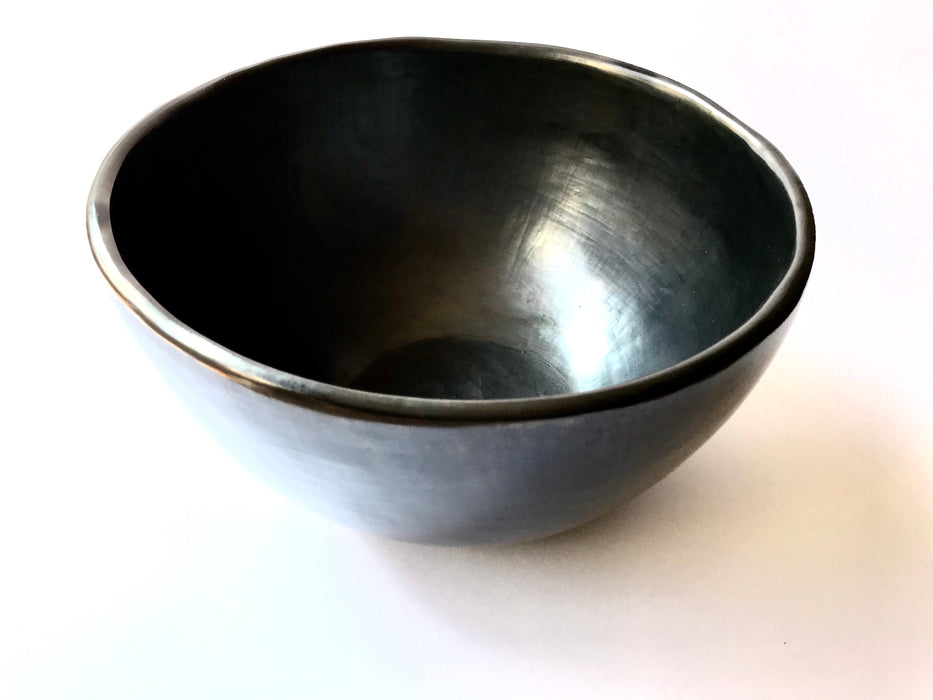 This impressive, handmade, black clay salad bowl from Oaxaca will always be a conversation piece at your dinner. Smooth, shiny black finish. 