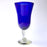 Mexico 1492: Shaped like a colored bell, with a transparent stem and foot, and hundreds of air bubbles reflecting the light, these classic wine glasses are a centerpiece and a conversation starter. Hand made with care, reflecting decades of traditional Mexican glass factories.  Available in Amethyst Purple, Turquoise, Fire Red, Cobalt Blue, Emerald Green, Lime Green and Smoke. 