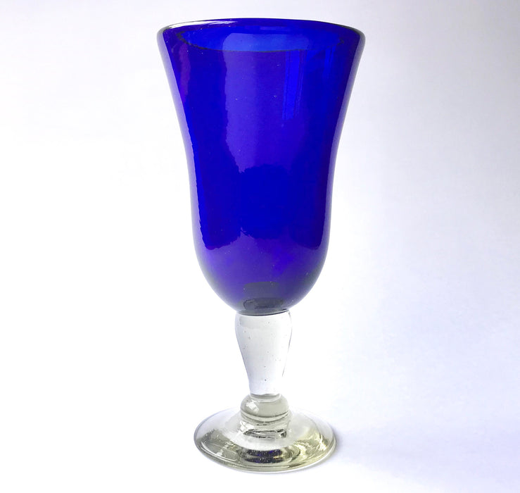 Mexico 1492: Shaped like a colored bell, with a transparent stem and foot, and hundreds of air bubbles reflecting the light, these classic wine glasses are a centerpiece and a conversation starter. Hand made with care, reflecting decades of traditional Mexican glass factories.  Available in Amethyst Purple, Turquoise, Fire Red, Cobalt Blue, Emerald Green, Lime Green and Smoke. 