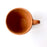 Mexico 1492: A rustic cup, made from red clay with a yellowish tone and marked with random flame spots, adding character. Best for serving coffee, tea, or hot chocolate. Lead free, unglazed. Thanks to the artisanal nature of this handmade product, no two pieces are the same. 