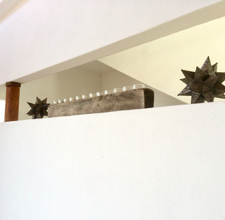 Mexico 1492: the molds like these are used as candle holders. We were lucky to find these made out of mango wood, with 12 cone-shaped holes each and a very smooth finish.   Available with or without candles and glasses. 