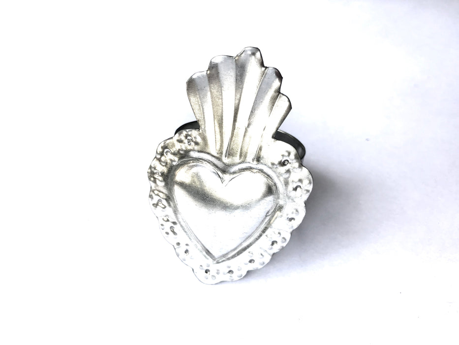 Mexico 1492: Handmade by Oaxacan artisans, using the repujado (embossing) technique, the Sacred Heart napkin holders celebrate one of the most frequently found motifs in the Mexican folk art. Available in 3 charming versions: Thorns, Beams and Flames.