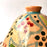 Mexico 1492: What happens when a traditional Morroccan clay dish gets transformed by warm, colorful, unstoppable Mexican creativity? Don Abel y doña Matea created a cultural fusion of Mexico and North Africa, so beautiful and imaginative. Traditional tajine, the predecessor of the modern crock pot, embellished by the talent and skill of the amazing Oaxacan artisans.  Handmade, painted and lead-free glazed in Oaxaca, Mexico.  Version: Grapevine.