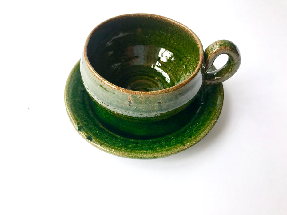 Mexico 1492: A wide, green glazed clay cup, with beautiful texture on the outside, and a symbolic swirl on the inside. Ideal for the morning cup of rich, foamy Oaxacan coffee, and a piece of sweet bread served with it.   Lead-free, handmade and glazed by the amazing artisans in Oaxaca, Mexico. 