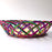 Mexico 1492: Thin wicker strings in many colors flow together and create this cheerful bread basket with a wooden base. Hand made by artisans from Estado de Mexico. 