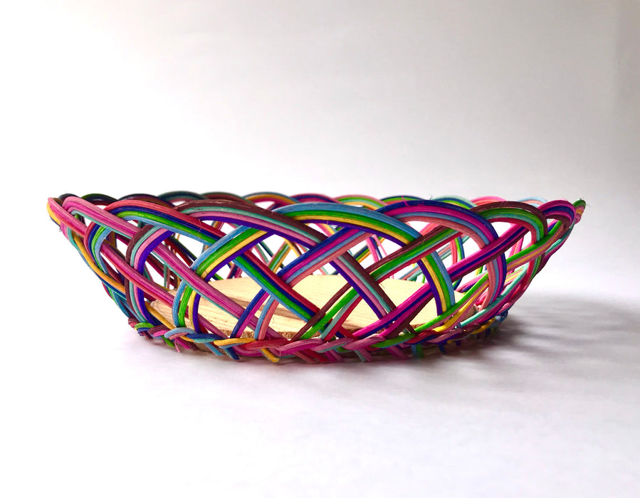 Mexico 1492: Thin wicker strings in many colors flow together and create this cheerful bread basket with a wooden base. Hand made by artisans from Estado de Mexico. 