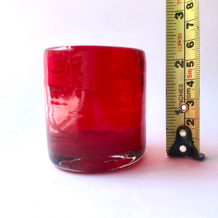 Mexico 1492: Hand blown shot glass with the trapped bubbles that pop color and start the fiesta on every occasion. Made by the master blowers in Mexico. Fire Red. 