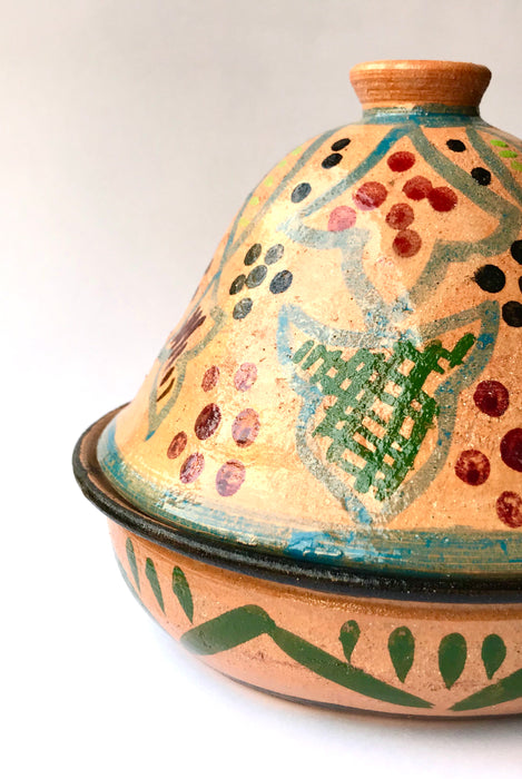 Mexico 1492: What happens when a traditional Morroccan clay dish gets transformed by warm, colorful, unstoppable Mexican creativity? Don Abel y doña Matea created a cultural fusion of Mexico and North Africa, so beautiful and imaginative. Traditional tajine, the predecessor of the modern crock pot, embellished by the talent and skill of the amazing Oaxacan artisans.  Handmade, painted and lead-free glazed in Oaxaca, Mexico.  Version: Grapevine.