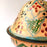 Mexico 1492: What happens when a traditional Morroccan clay dish gets transformed by warm, colorful, unstoppable Mexican creativity? Don Abel y doña Matea created a cultural fusion of Mexico and North Africa, so beautiful and imaginative. Traditional tajine, the predecessor of the modern crock pot, embellished by the talent and skill of the amazing Oaxacan artisans.  Handmade, painted and lead-free glazed in Oaxaca, Mexico.  Version: Grapevine.