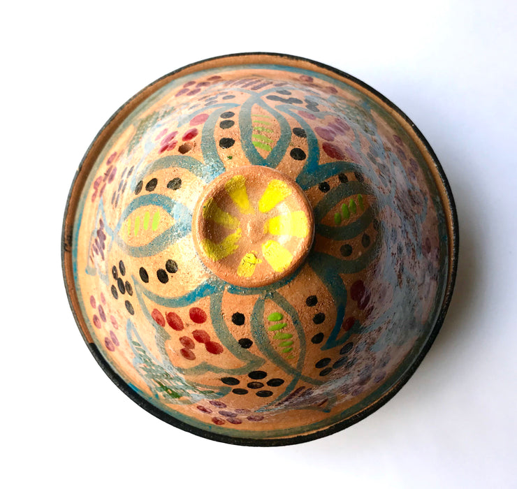 Mexico 1492: What happens when a traditional Morroccan clay dish gets transformed by warm, colorful, unstoppable Mexican creativity? Don Abel y doña Matea created a cultural fusion of Mexico and North Africa, so beautiful and imaginative. Traditional tajine, the predecessor of the modern crock pot, embellished by the talent and skill of the amazing Oaxacan artisans.  Handmade, painted and lead-free glazed in Oaxaca, Mexico.  Version: Grapevine.