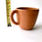Mexico 1492: A rustic cup, made from red clay with a yellowish tone and marked with random flame spots, adding character. Best for serving coffee, tea, or hot chocolate. Lead free, unglazed. Thanks to the artisanal nature of this handmade product, no two pieces are the same. 
