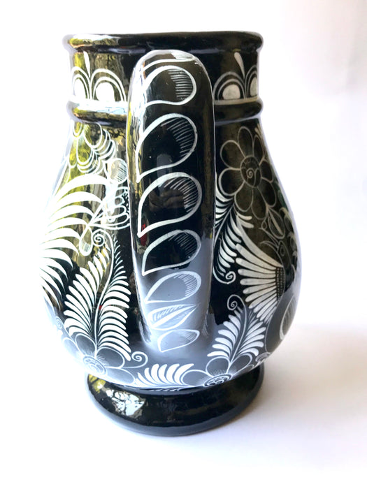 Mexico 1492 - Large, glazed, hand painted pitcher. Black with white drawings of plants and birds. Artisanal work from Guerrero, Mexico. 
